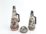 two vases that are sitting next to each other