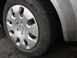 a close up of a tire on a white car