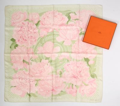 pink and green floral print scarf with orange box on white background
