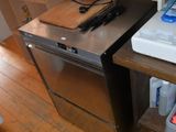 a kitchen with a stove, sink, dishwasher, and dishwasher in it