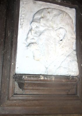 a picture of a picture of a man ' s face on a wall