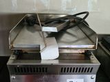 an image of a toaster sitting on top of a counter next to a toaster oven
