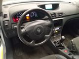 the interior of a car with a steering wheel and dashboard controls