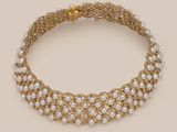 a gold and pearl necklace