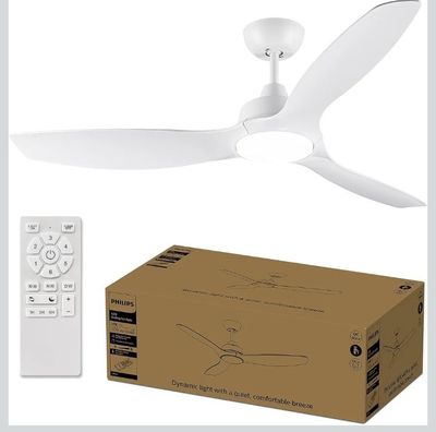 a white ceiling fan with a remote control next to a box