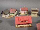 a lot of small model houses that are on a table