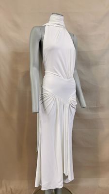 the mannequin is wearing a white dress on a mannequin stand