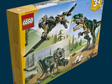 a box of legos with a picture of a t - rex on it