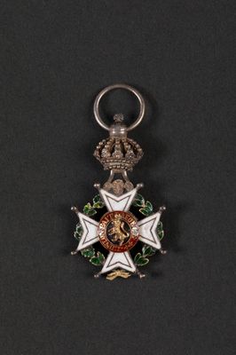 a close up of a medal on a black surface