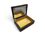 a small wooden box with a glass lid on a white surface