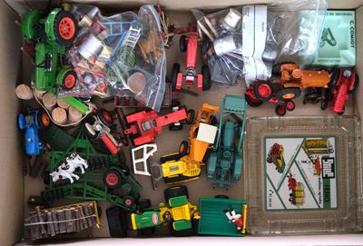 a box full of toy trains and other toy vehicles