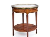 a round table with a marble top and wooden legs