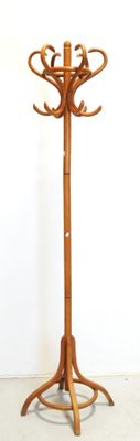 a wooden coat stand with a coat rack on top of it