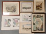 de nombreuses cartes encadrées représentant différents pays accrochées au mur