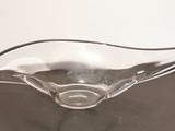 a glass bowl that is sitting on a table