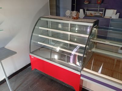a display case in a store with a red and white color