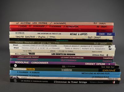 many books stacked on top of each other on a table