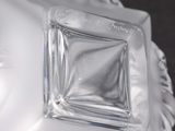 a close up of a glass vase with a horse head on it