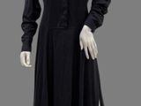 an image of a mannequin dressed in a black dress