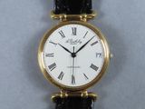 a close up of a wrist watch with roman numerals