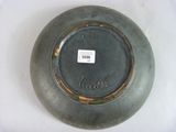a gray plate with a black label on it