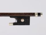 a close up of a violin bow on a white background