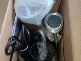 a box with scissors, a pair of scissors, and other items in it