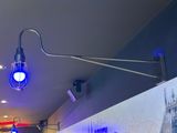 a blue light that is on the ceiling of a restaurant