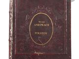 the front cover of a red book with gold lettering on it