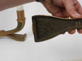 a person that is holding a brass object in their hand