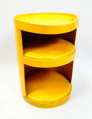 a yellow table with three shelves on top of it