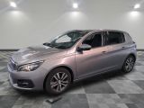 a picture of a silver car parked in a showroom