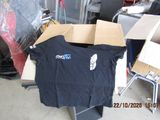 a black t - shirt sitting on top of a cardboard box