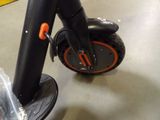 a close up of a scooter that is on the floor