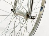 a close up view of a bicycle wheel with spokes