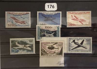 a lot of stamps that are on display in a glass case