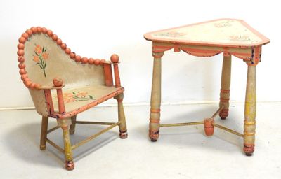 two chairs and a table that are sitting next to each other
