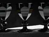 three empty wine glasses sitting on a table