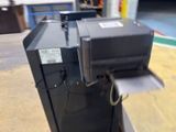 a machine that is sitting on a table in a warehouse