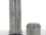 three different types of metal containers sitting on a white surface