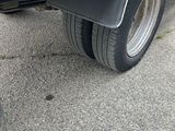 a black truck that is parked on the side of the road