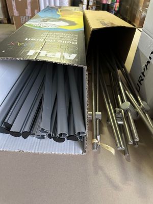 a cardboard box with a bunch of metal rods inside of it