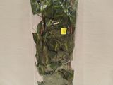 a bag of lettuce wrapped in plastic and sitting on a table
