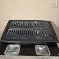 a black sound board sitting on top of a wooden table