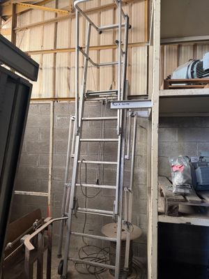 a ladder that is next to a window in a room