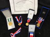 a group of medals and medals sitting on top of a table