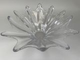 a clear glass bowl with a flower design on it