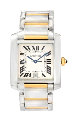 une montre en argent et en or dont le cadran est orné de chiffres romains