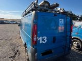 an image of a blue van parked in a parking lot