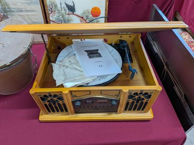 a small wooden box with a record player inside of it